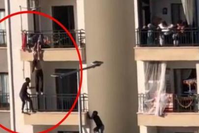 Balkondan düşmek üzere olan çocuğu balkondan tırmanarak kurtardı
